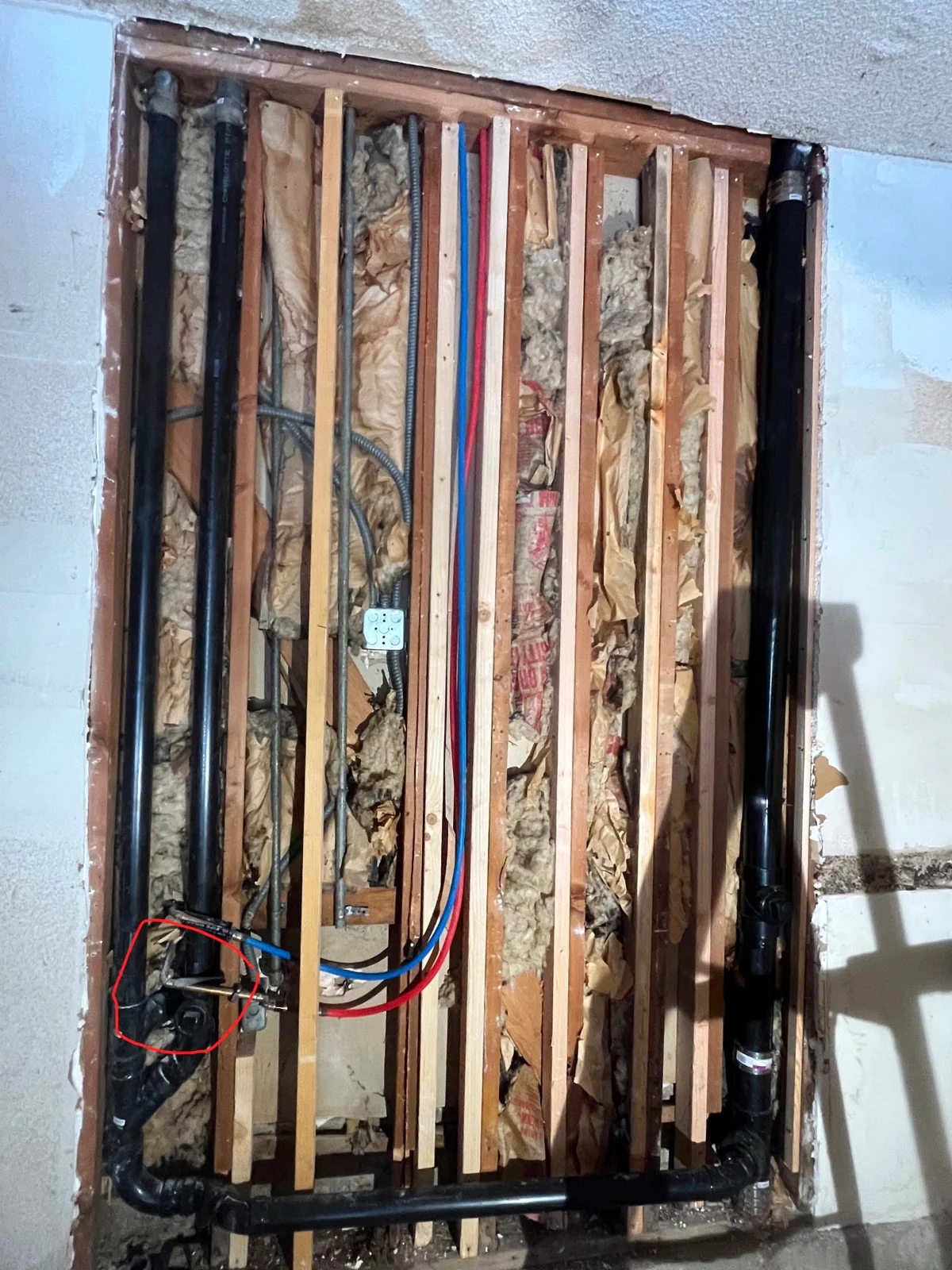 Supply and drain lines exposed during bathroom work